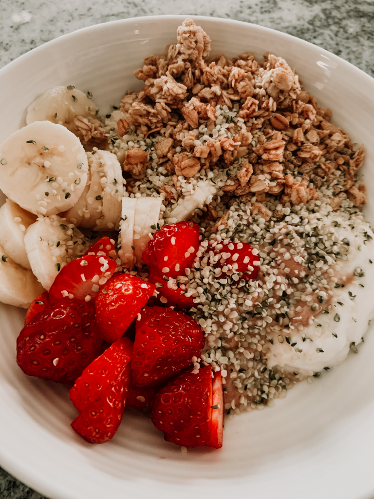 Chia pudding topped with granola, berries, hemp hearts and banana